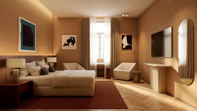 Recreación de una habitación de The Meliá Collection Rome, con cama doble, butacas y piso de madera en espiga