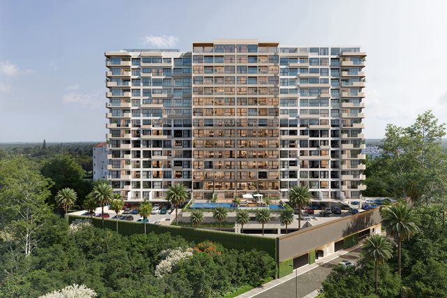 Render exterior de la torre VMAR Juan Dolio, de 18 niveles, rodeada de vegetación